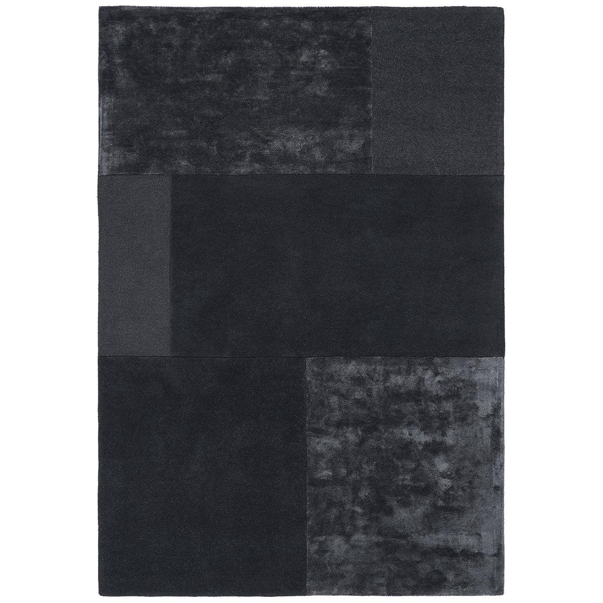 Black and gray checkered rug on a white background