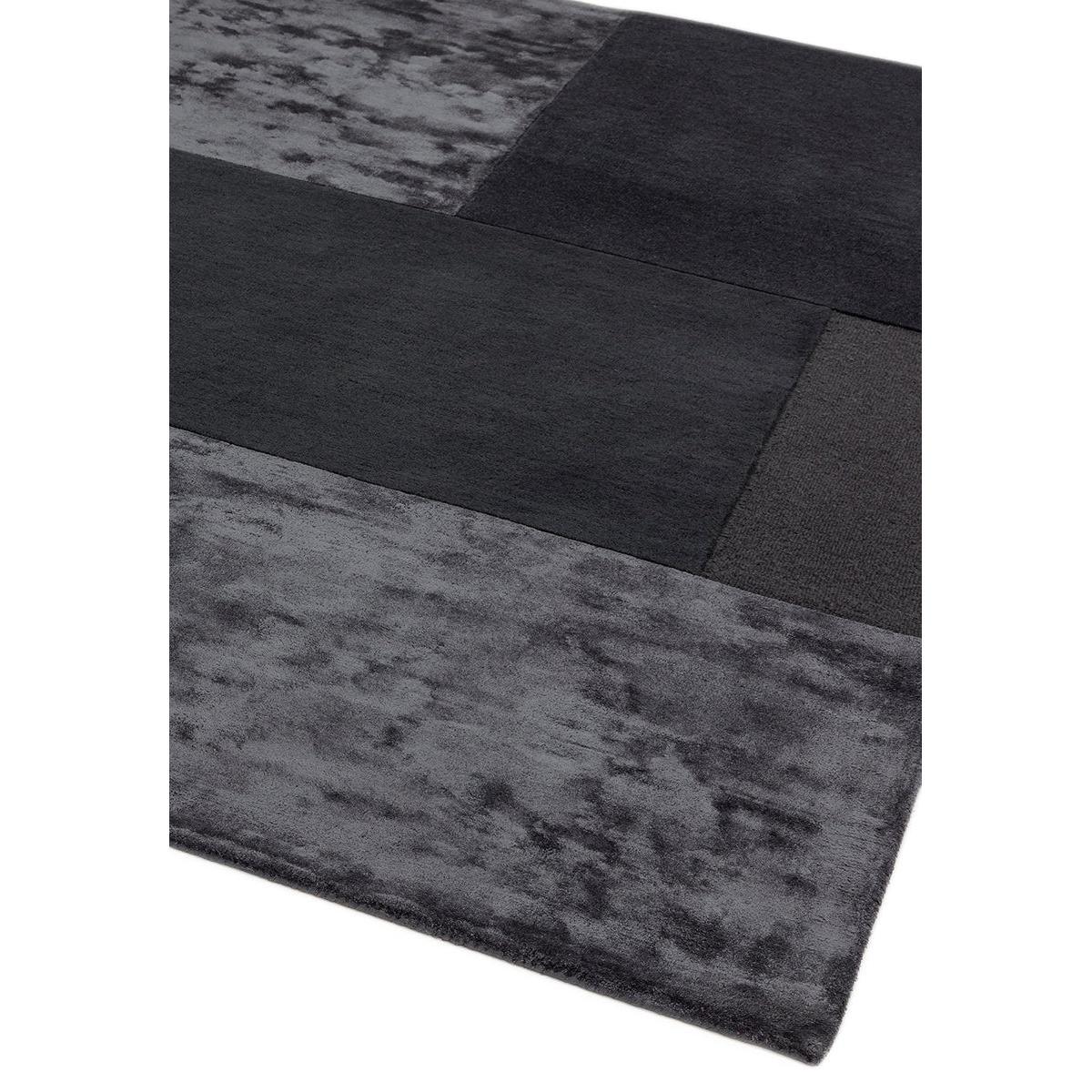 Asiatic Tate Charcoal Rug featuring patchwork geometric blocks in charcoal, dark grey, slate and black on charcoal background, machine-woven polypropylene