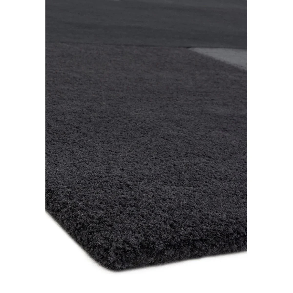 Asiatic Tate Charcoal Designer Rug featuring solid shaggy texture in charcoal grey on charcoal background