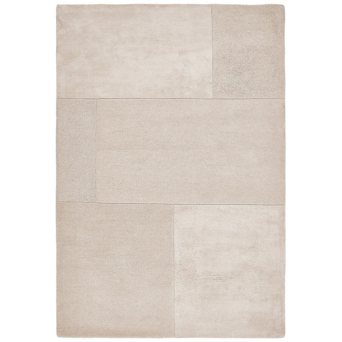 Beige rug with a textured pattern on a white background