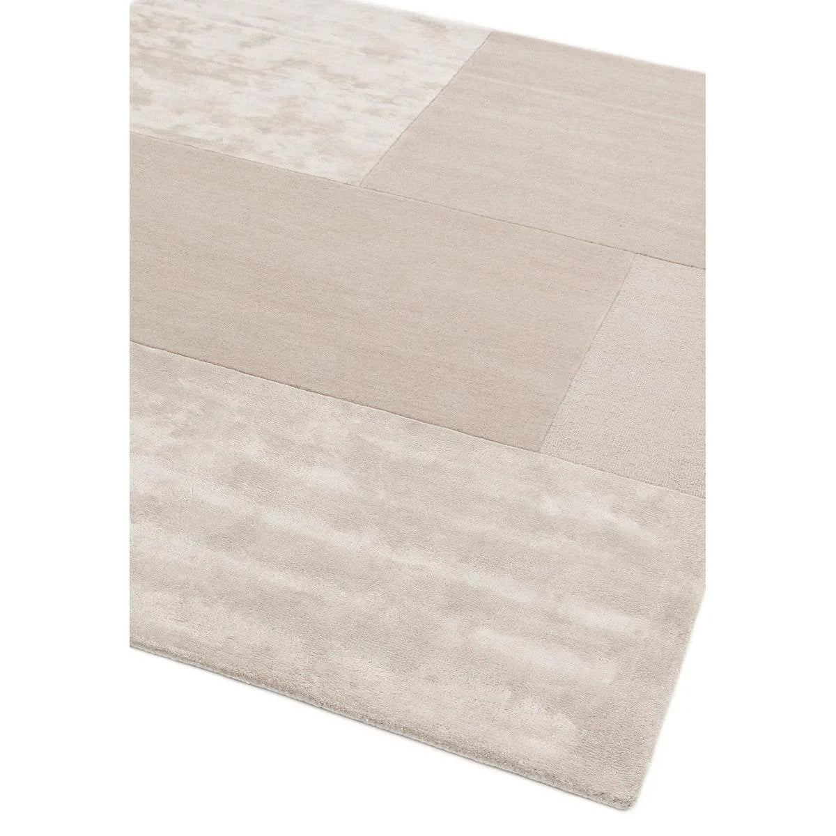 Close-up of a beige and brown patterned rug on a white background