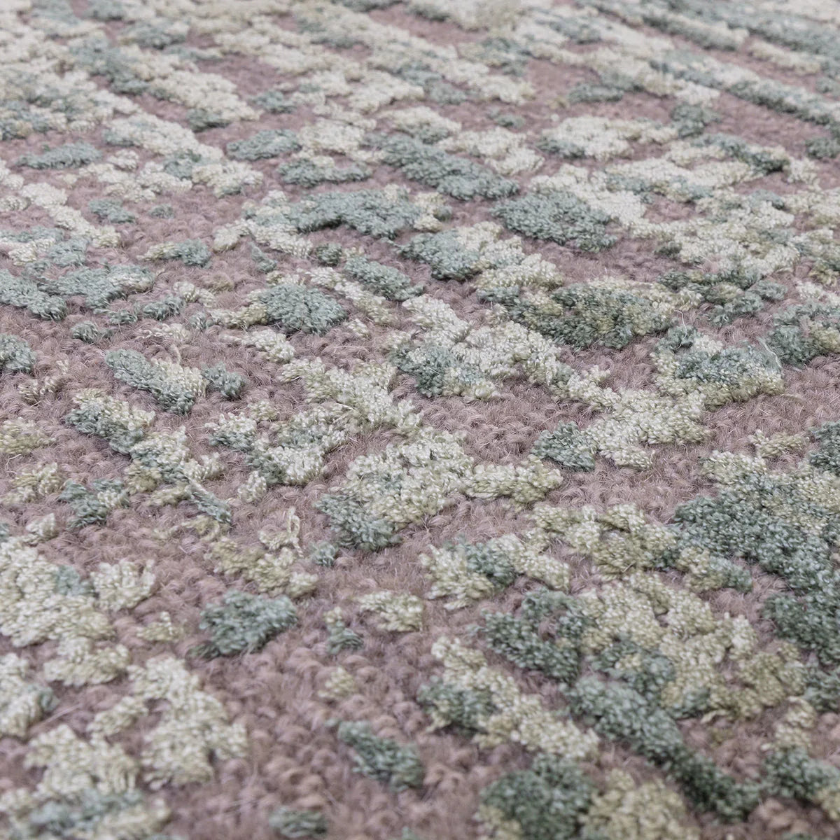Asiatic Torino Forest Green Rug featuring textured tufted clusters in forest green, cream and sage on mauve background, hand-tufted wool