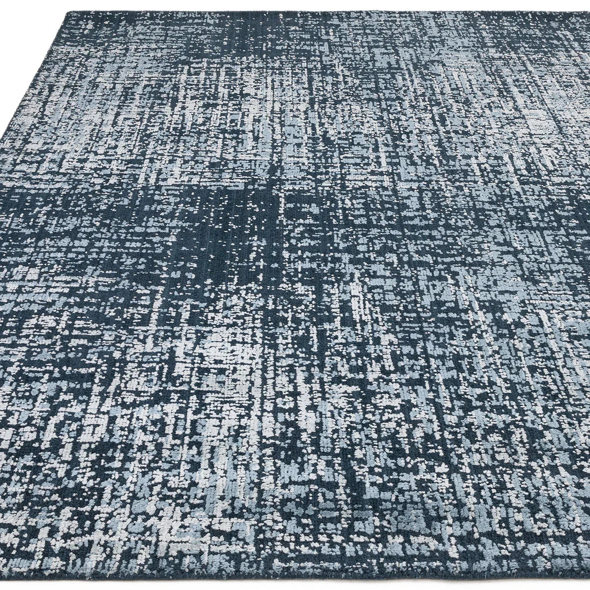 Asiatic Torino Petrol Blue Designer Rug featuring abstract distressed pattern in petrol blue, steel blue and light grey on blue background