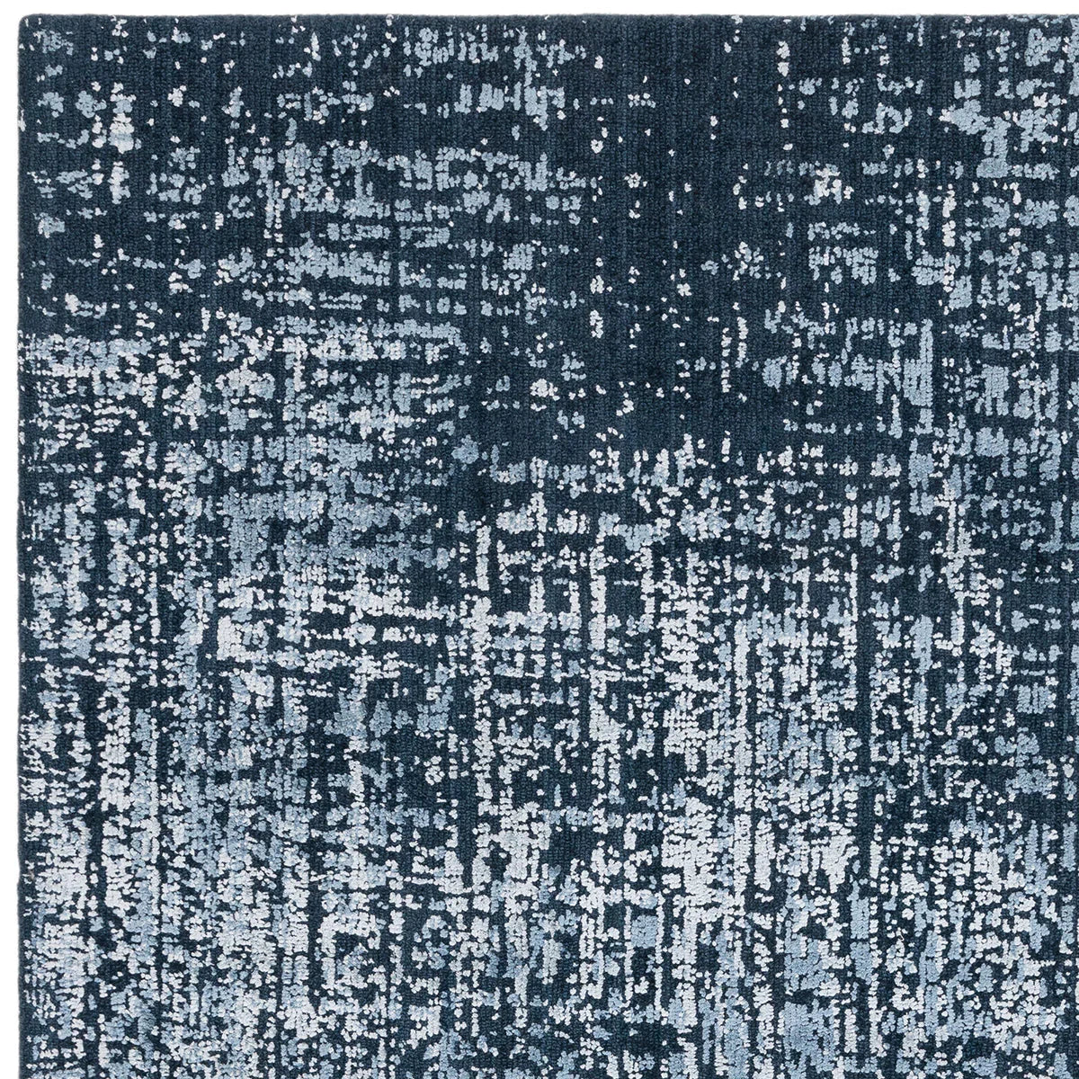 Asiatic Torino Petrol Blue Rug featuring abstract distressed pattern in petrol blue, steel blue and light blue on navy background, machine-made wool blend
