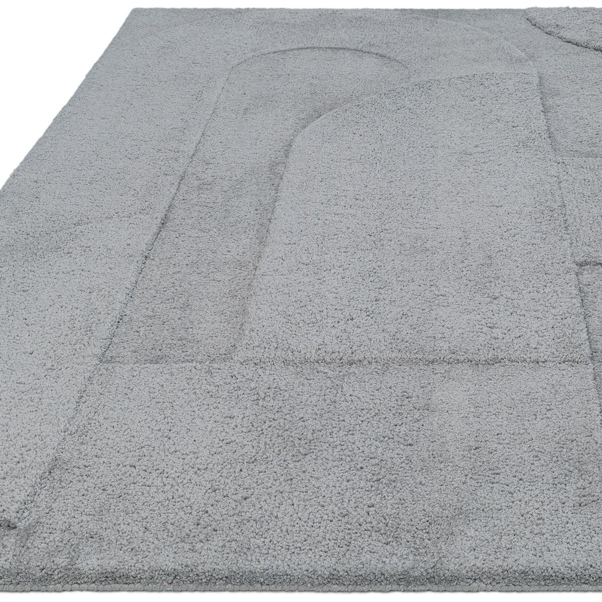 Asiatic Tova Blue Designer Rug featuring abstract geometric pattern in steel blue and grey on pale background, hand-tufted wool