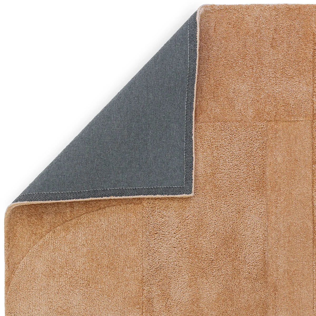 Asiatic Tova Clay Designer Rug featuring textured clay surface with blue underside on white background, hand-tufted wool