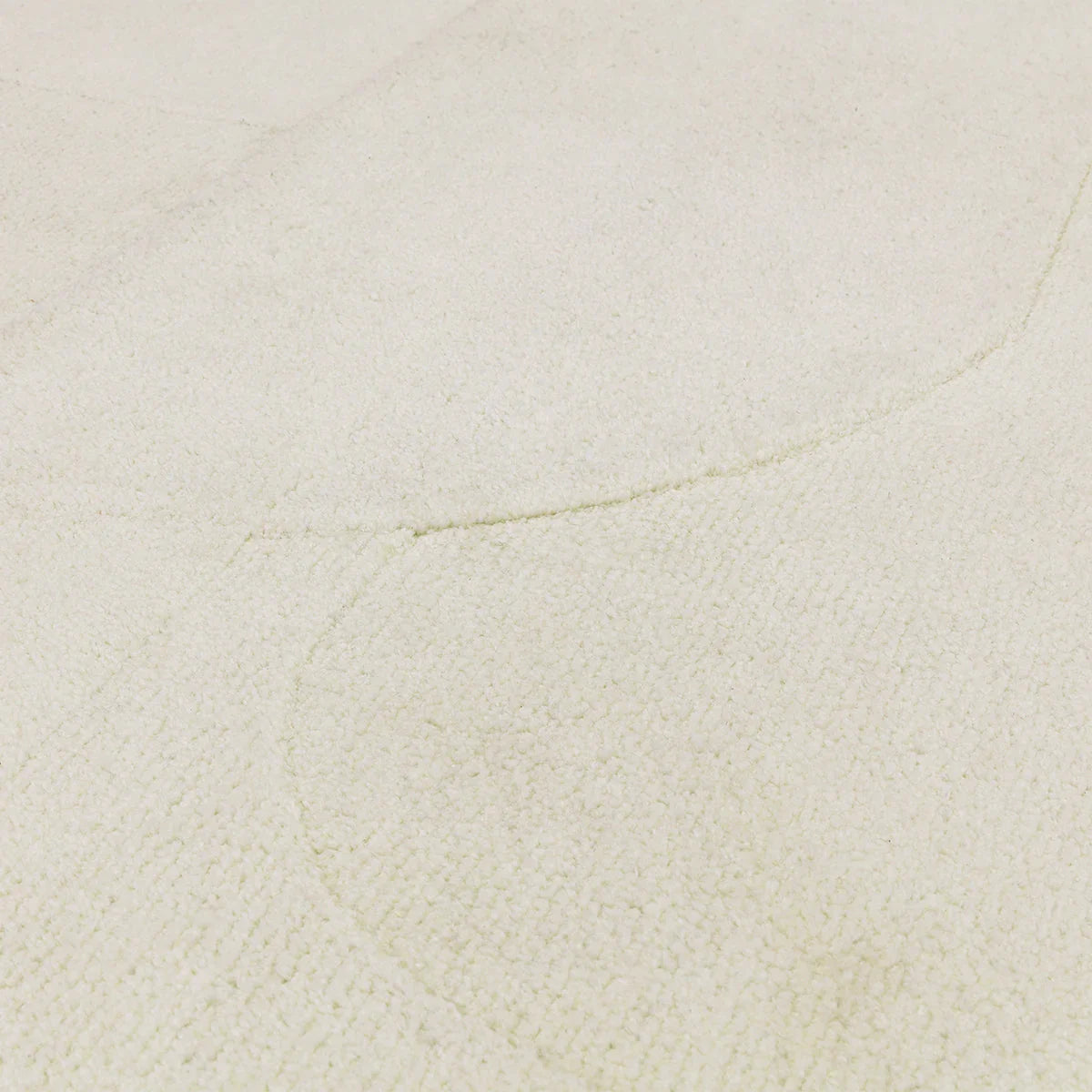 Asiatic Tova Ivory Designer Rug featuring a textured solid field in ivory/cream on warm ivory background, hand-tufted wool