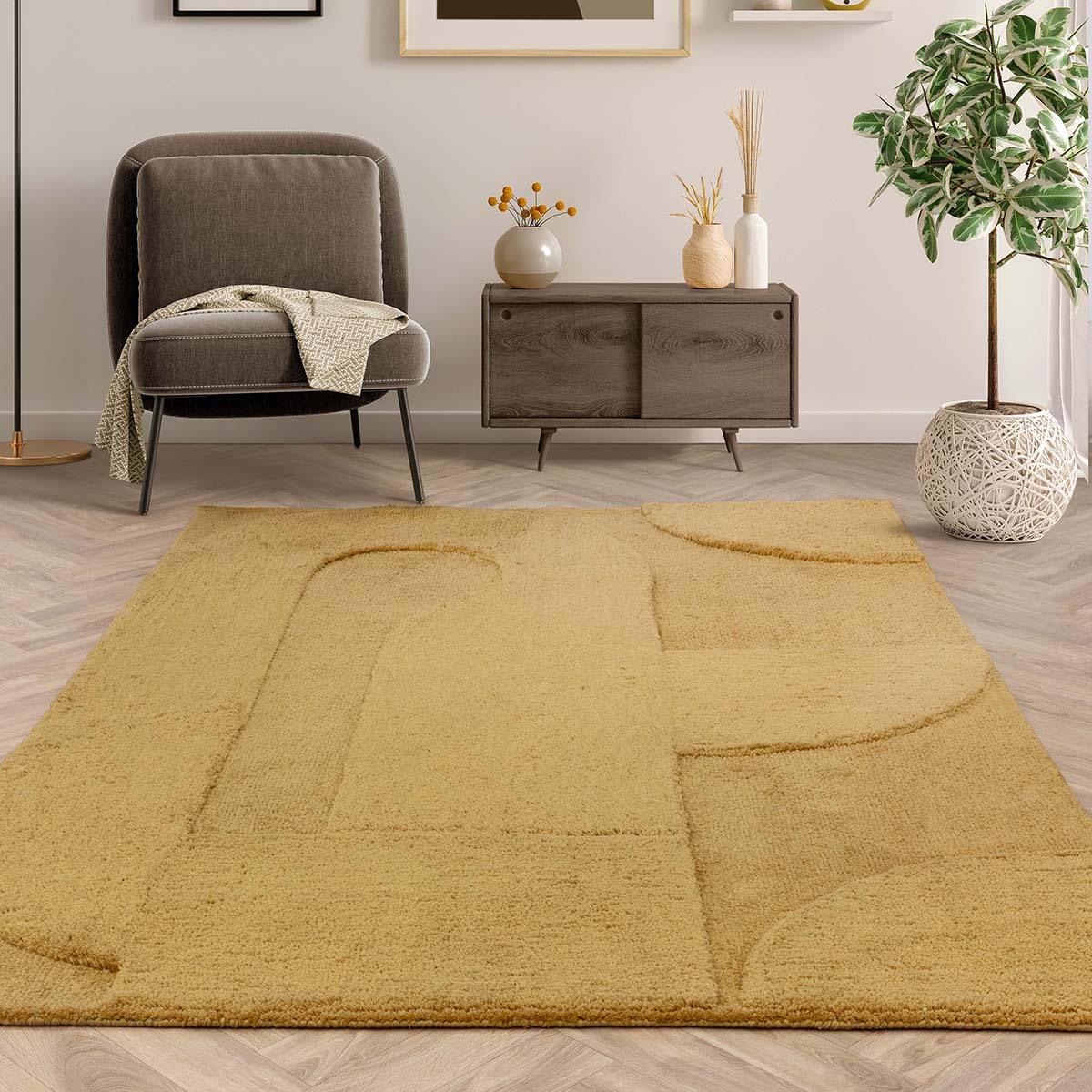 Yellow area rug in a living room with a chair and decorative items.