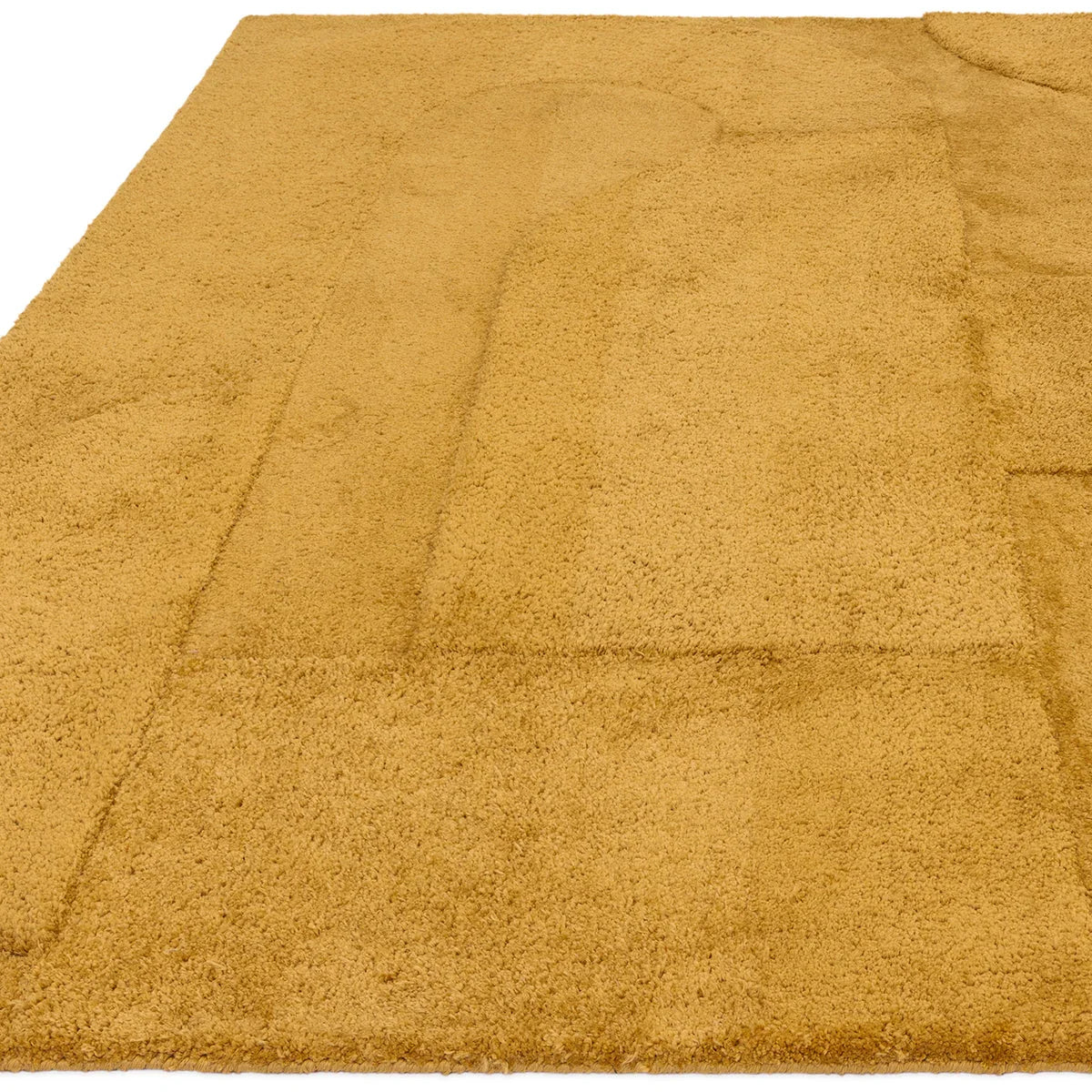 Asiatic Tova Ochre Designer Rug featuring solid textured pile in ochre, amber and golden on white background, machine-made wool