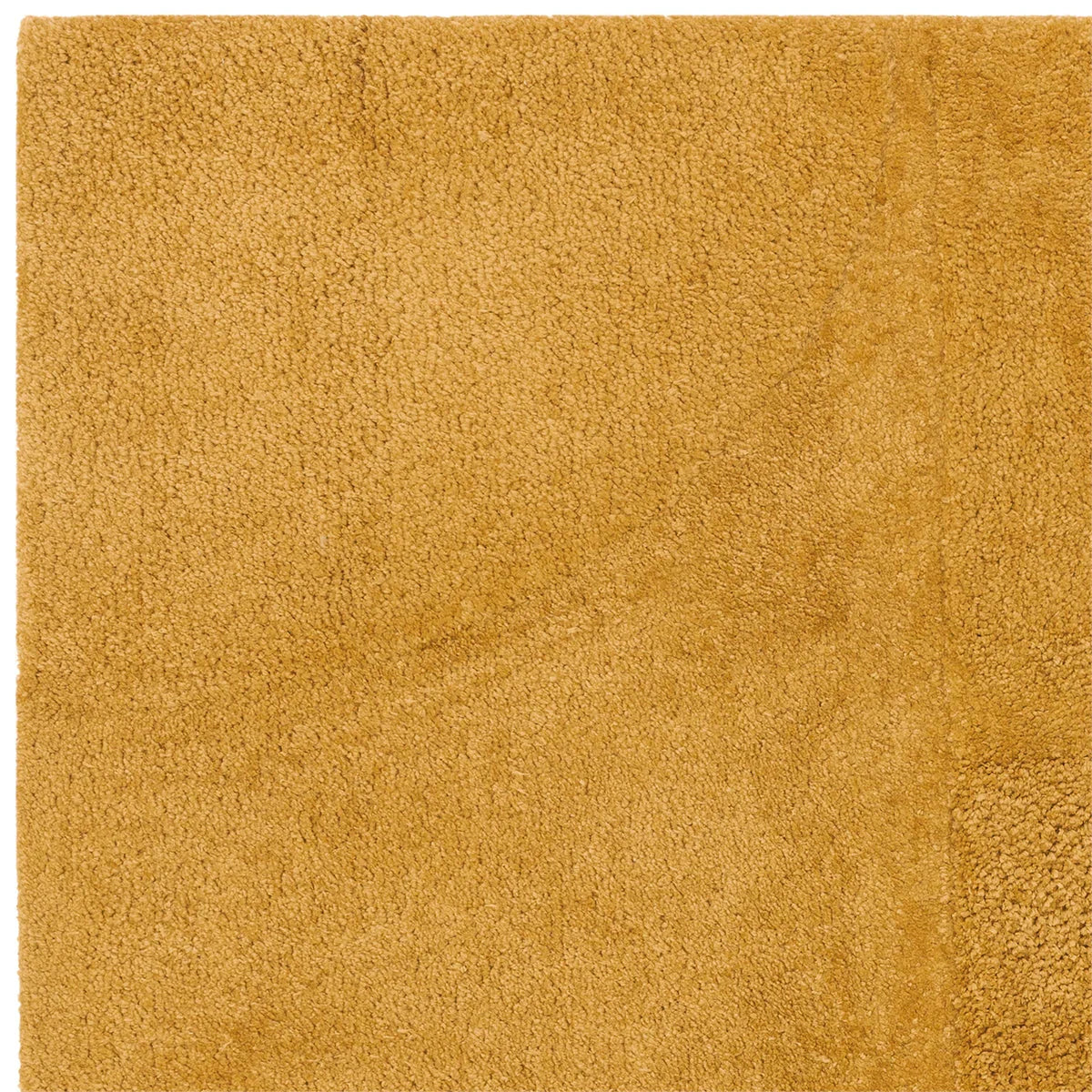 Asiatic Tova Ochre Designer Rug featuring solid shaggy texture in ochre on warm ochre background, hand-tufted wool