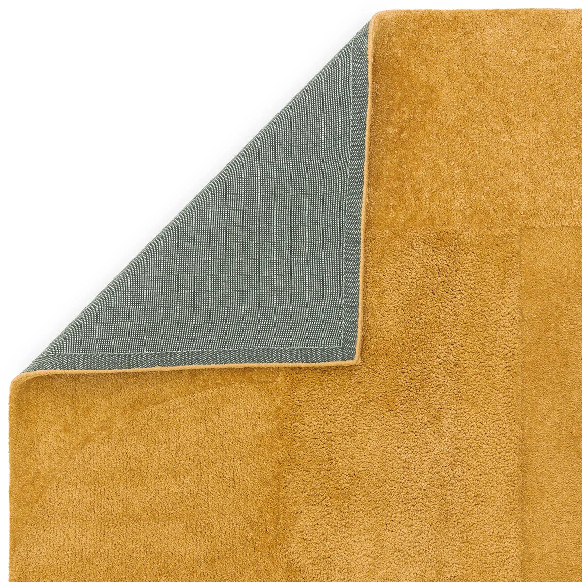 Asiatic Tova Ochre Designer Rug featuring solid ochre pile with grey reverse, hand-tufted wool