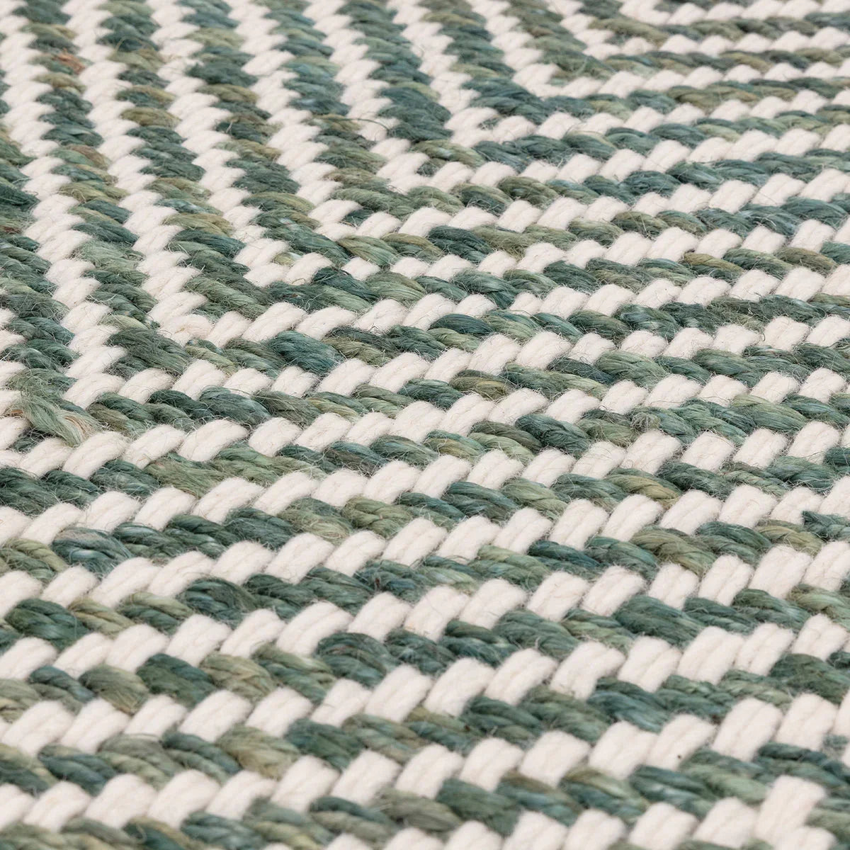 Asiatic Vigo Green Designer Rug featuring striped braided pattern in white and greens on ivory background, hand-woven wool