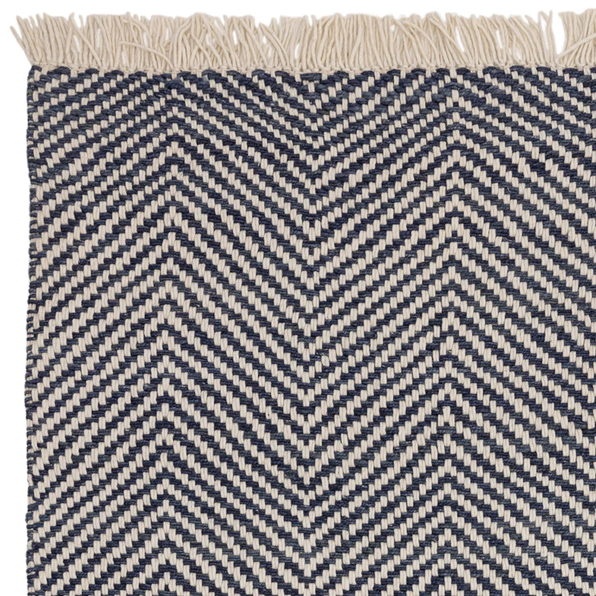 Asiatic Vigo Navy Designer Rug featuring chevron zigzag pattern in navy blue and ivory on cream background, hand-tufted wool