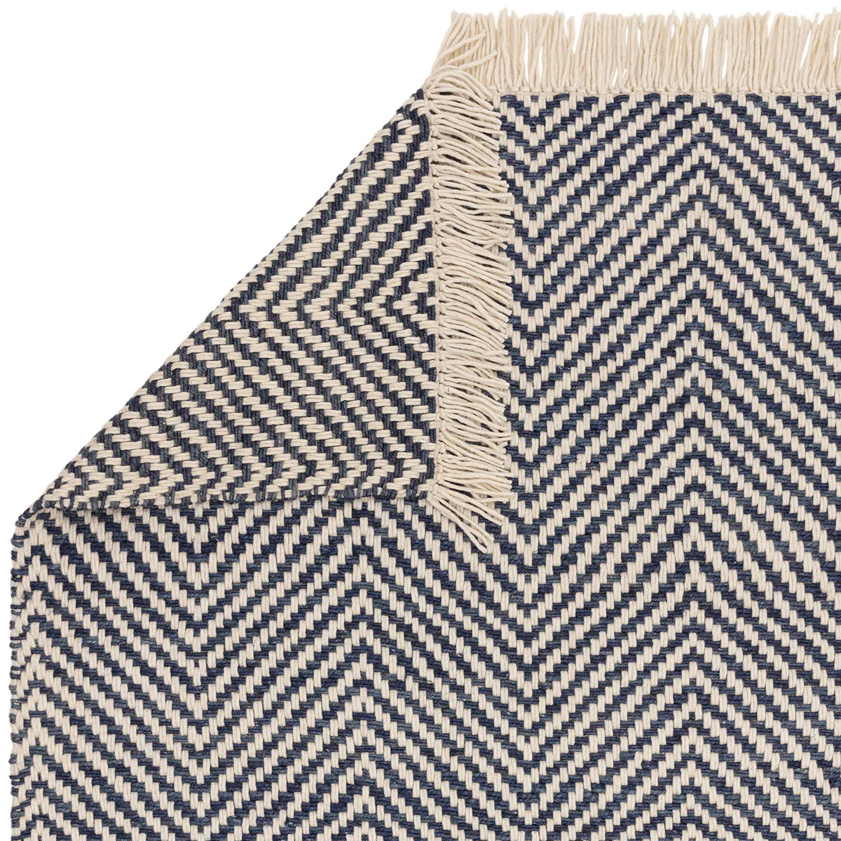 Asiatic Vigo Navy Designer Rug featuring chevron zigzag pattern in navy blue and cream on ivory background, hand-woven wool