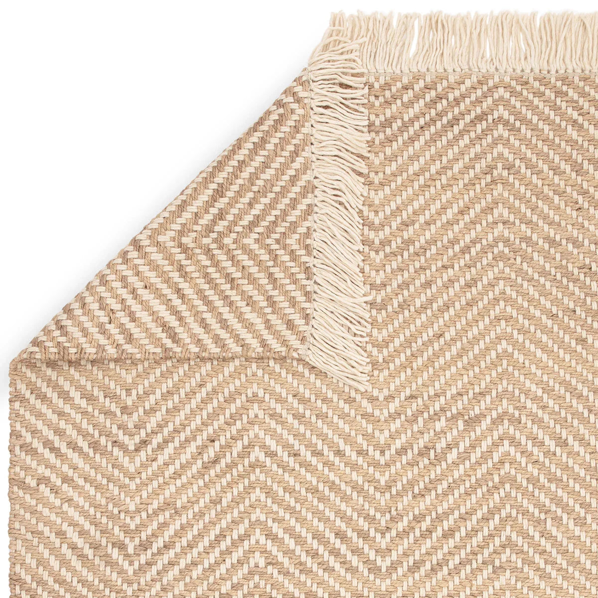 Asiatic Vigo Sand Rug featuring chevron herringbone pattern in sand, beige and taupe on light sand background, hand-woven jute