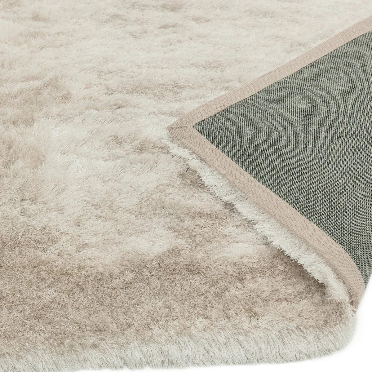 Asiatic Whisper Champagne Rug featuring shaggy plush in champagne, ivory and taupe on ivory background, machine-made wool blend