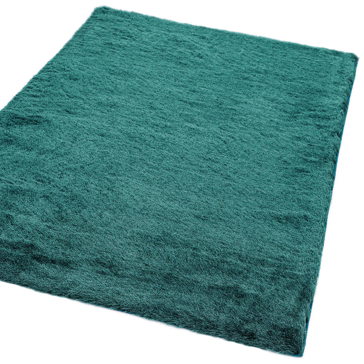 Asiatic Whisper Dark Teal Rug featuring shaggy solid texture in dark teal on white background, machine-made polypropylene