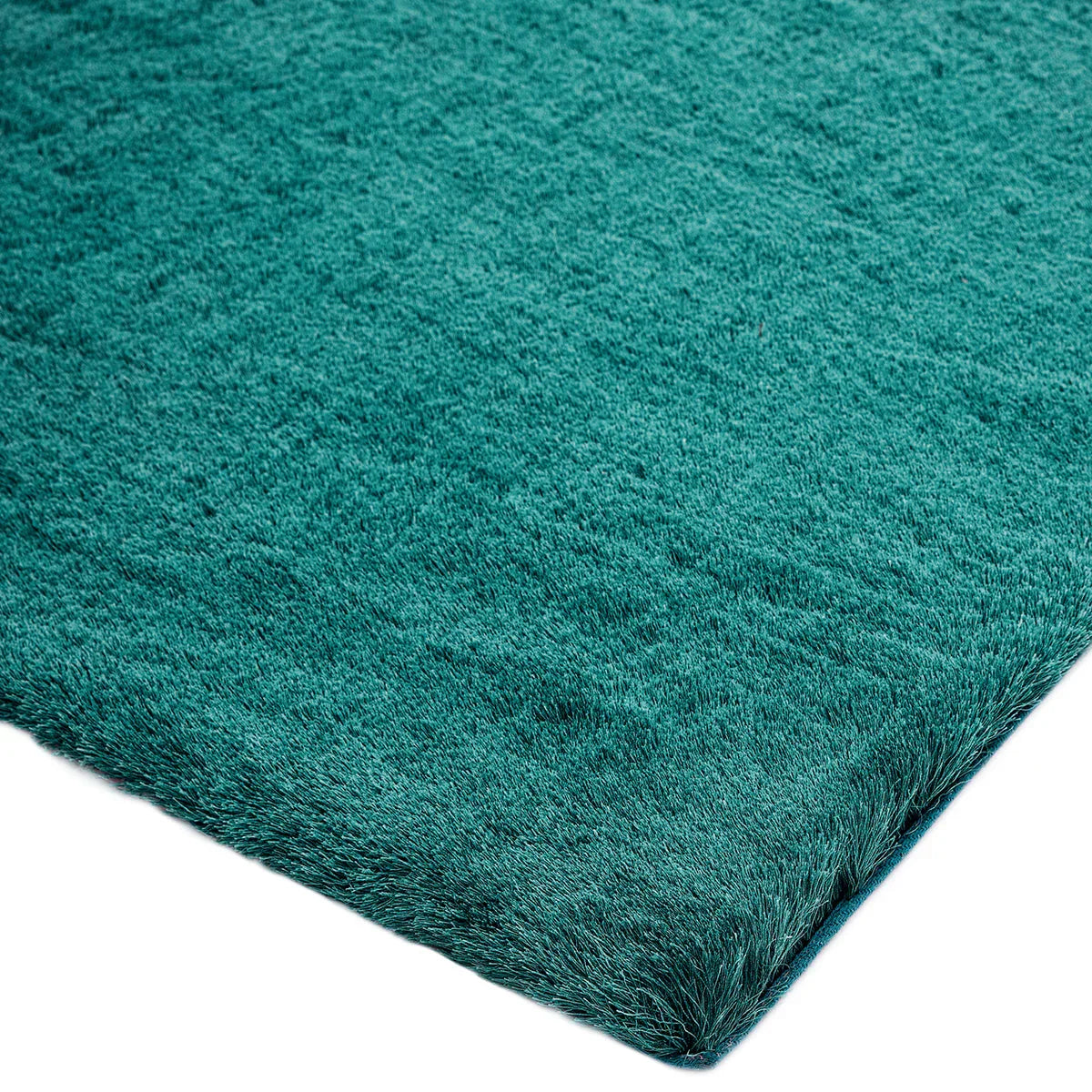 Asiatic Whisper Dark Teal rug featuring solid shaggy pile in dark teal on teal background, hand-tufted wool