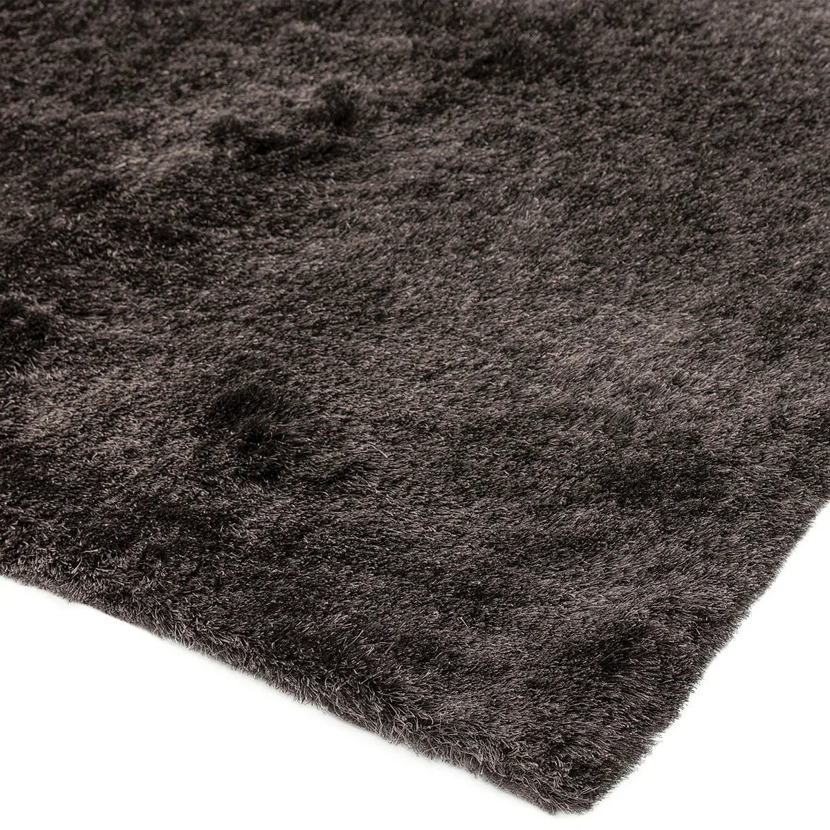 Asiatic Whisper Graphite Designer Rug featuring shaggy pile in graphite, charcoal and black on dark charcoal background, shag pile synthetic fibres