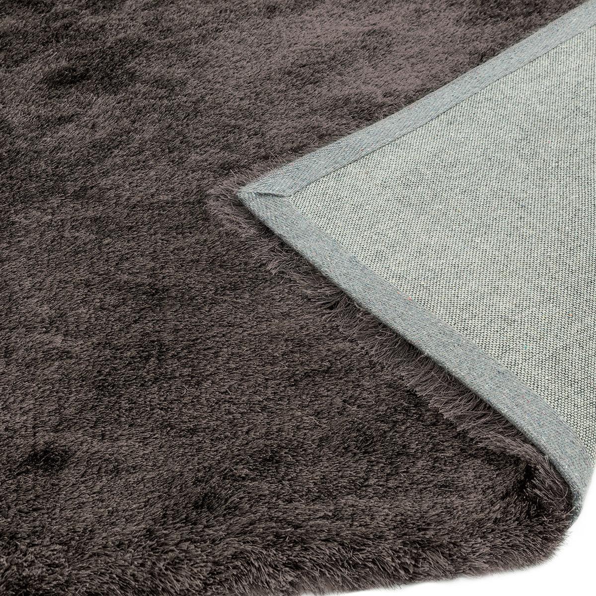 Asiatic Whisper Graphite Rug featuring shaggy graphite pile in charcoal, slate and light grey on grey backing, hand-tufted wool