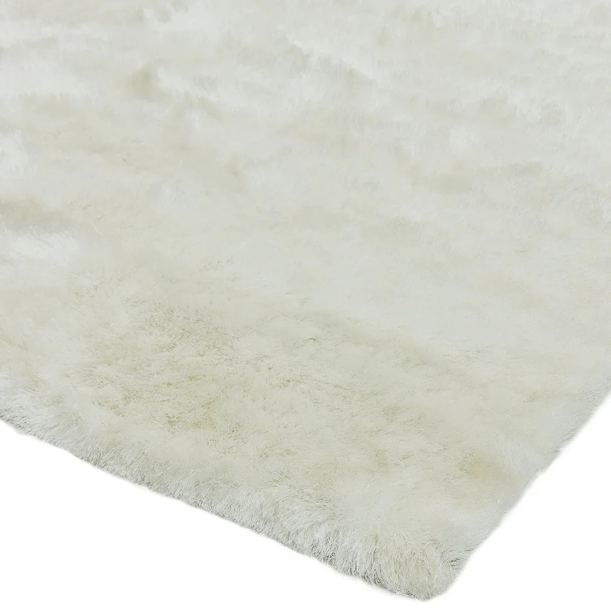 Asiatic Whisper Ivory rug featuring fluffy shaggy texture in ivory and cream on ivory background, hand-tufted wool