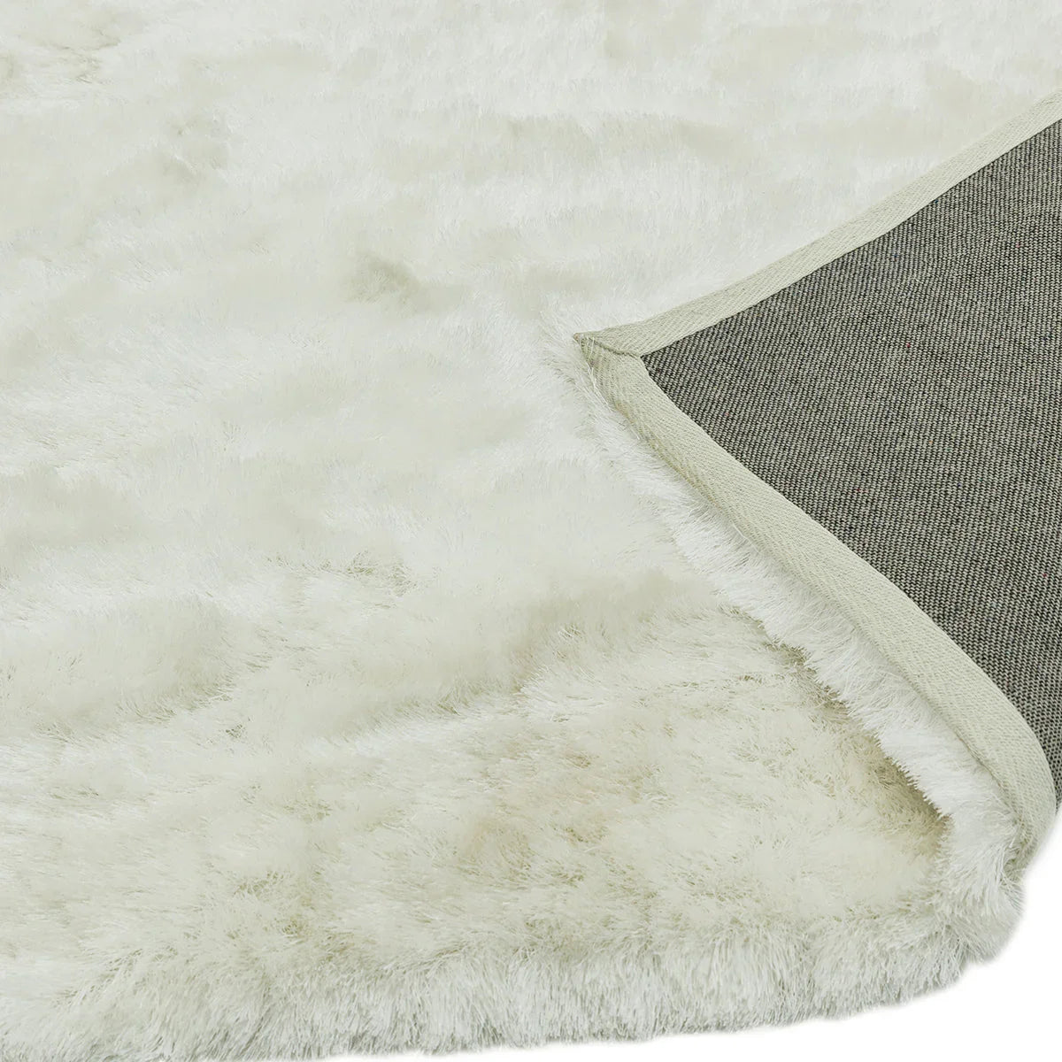 Asiatic Whisper Ivory Rug featuring solid shag in ivory/cream on ivory background, machine-made polyester