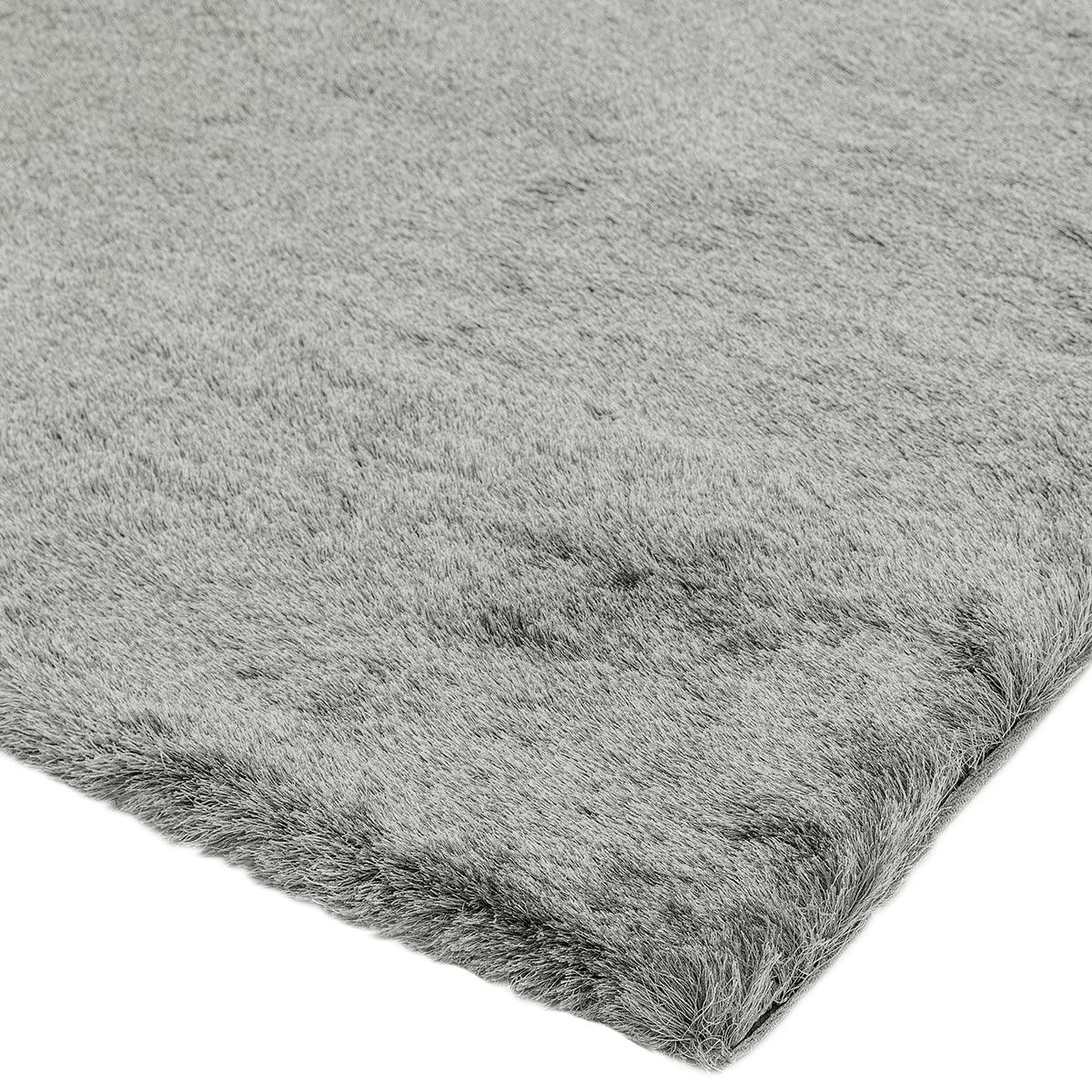 Asiatic Whisper Tungsten rug featuring solid shaggy pile in tungsten grey on white background, machine-made wool