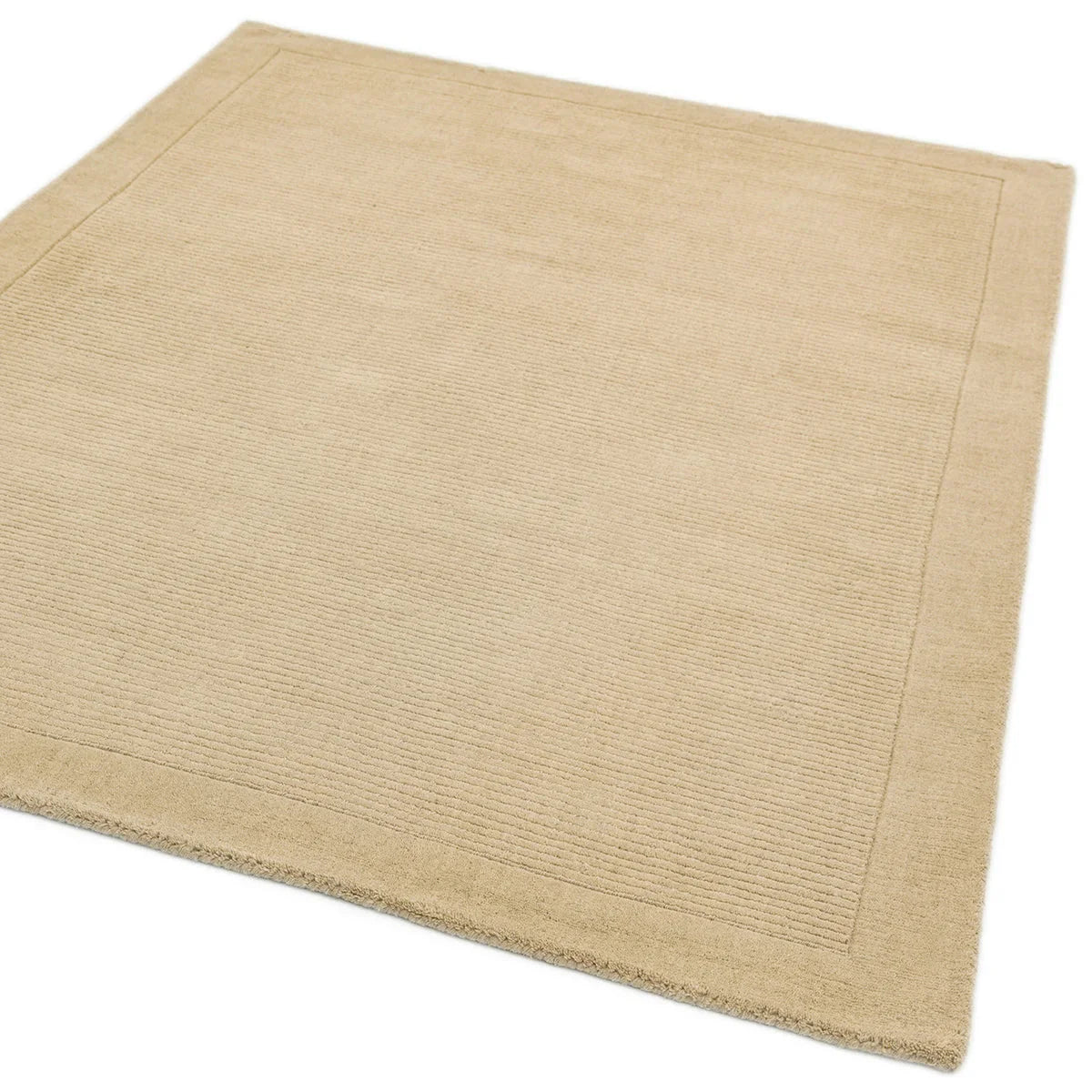 Asiatic York Beige Designer Rug featuring minimalist solid pattern in beige on warm beige background, hand-tufted wool
