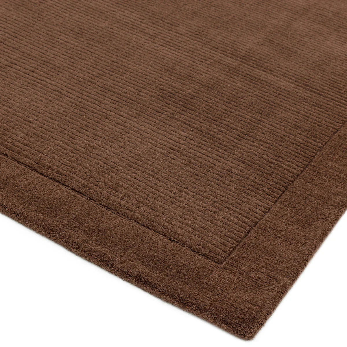 Asiatic York Chocolate Rug featuring solid ribbed texture in chocolate brown on white background, hand-tufted wool