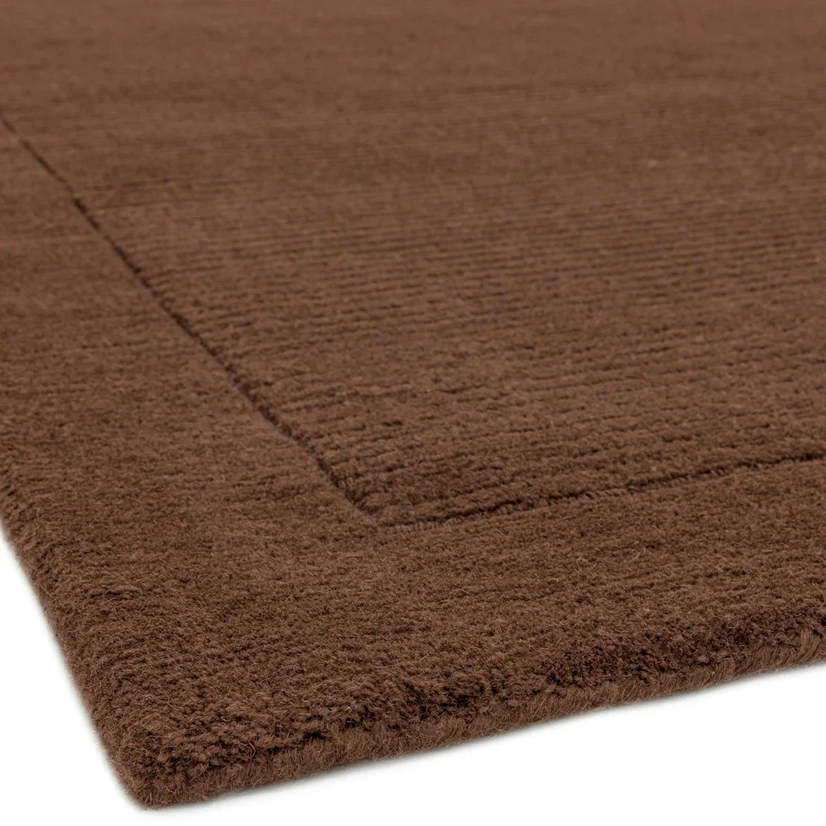Asiatic York Chocolate Designer Rug featuring solid textured pattern in rich chocolate brown on chocolate background, machine-made polypropylene