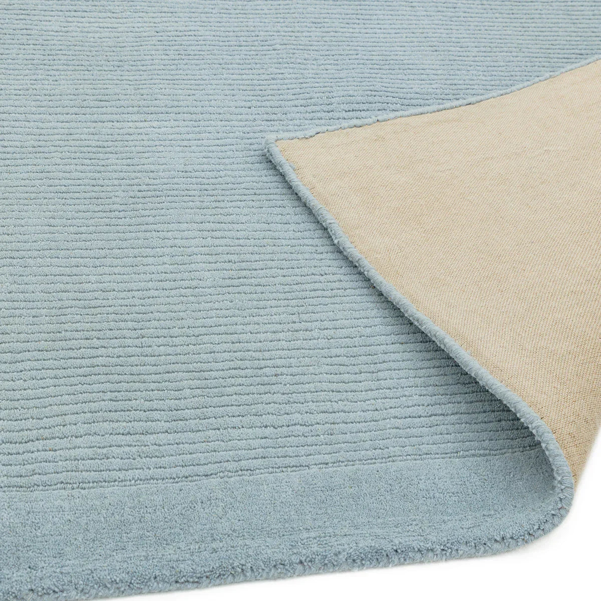 Asiatic York Duck Egg Designer Rug featuring ribbed linear texture in duck egg blue with beige reverse, hand-tufted wool