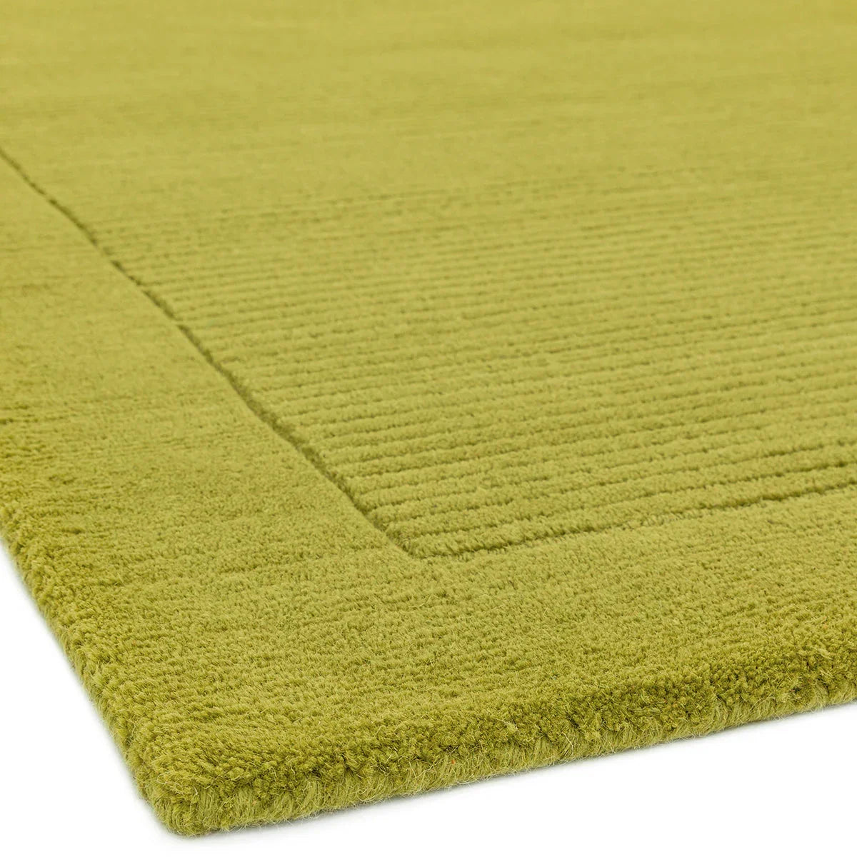 Asiatic York Green Designer Rug featuring solid textured pattern in olive green on white background, machine-made wool