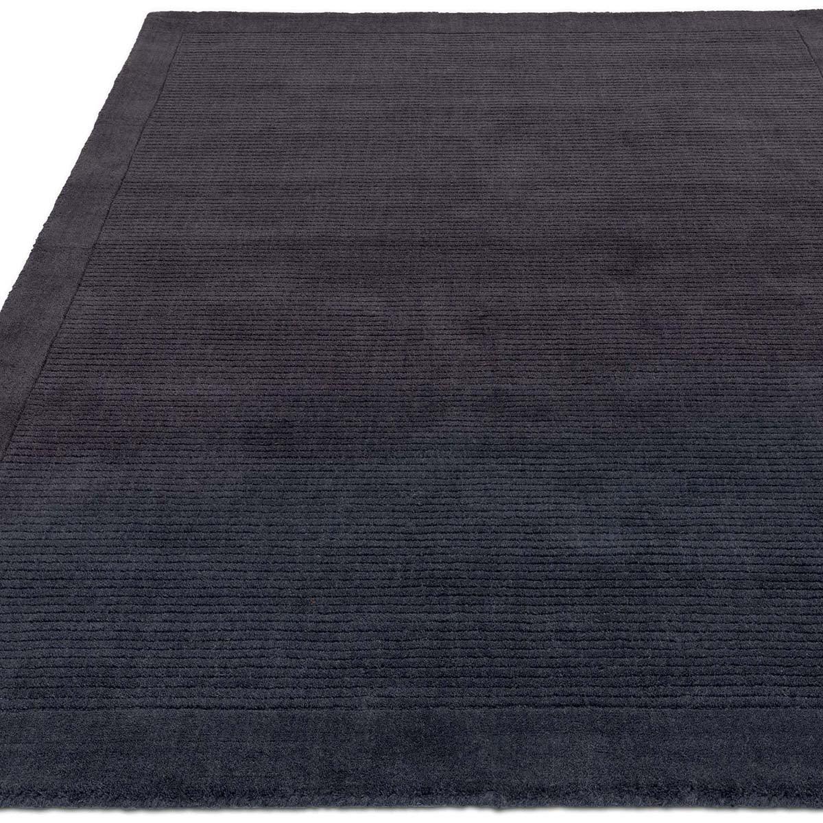 Asiatic York Navy Designer Rug featuring subtle ribbed stripes in navy and midnight blue on white background, hand-tufted wool