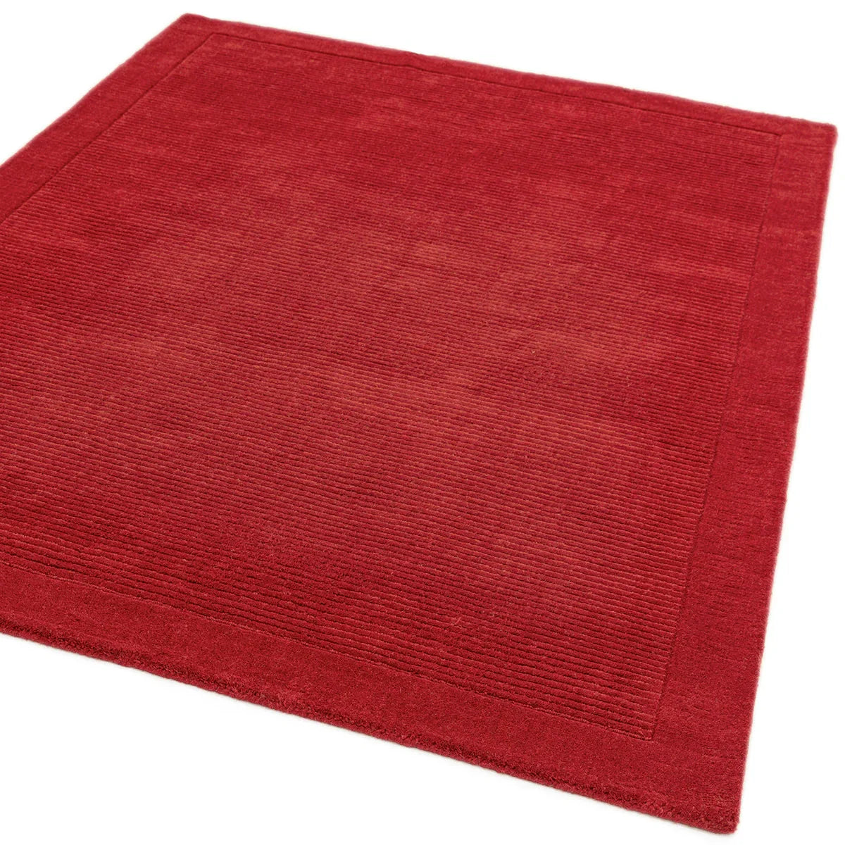 Asiatic York Poppy Designer Rug featuring solid ribbed texture in crimson red, scarlet on white background, machine-loomed polypropylene