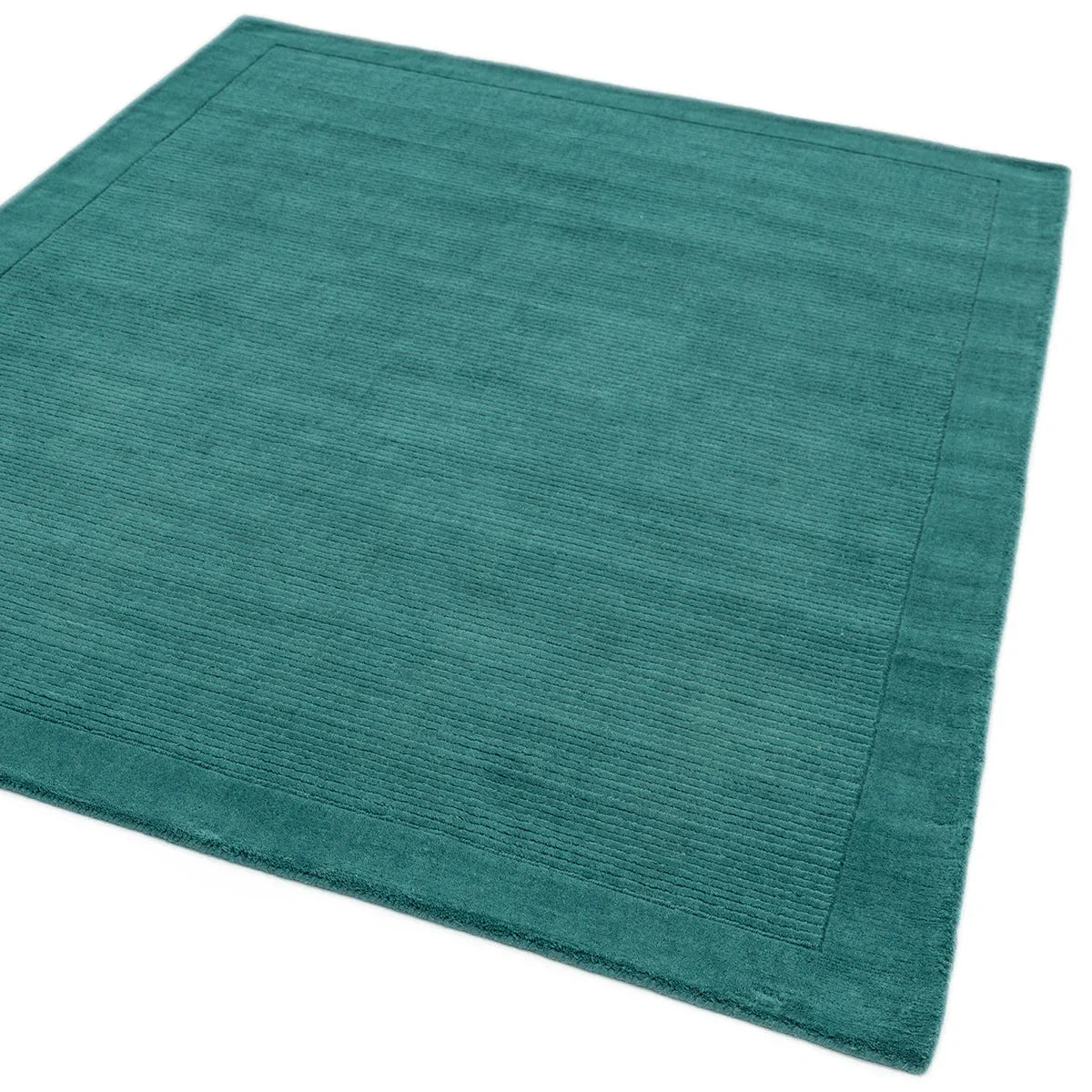Asiatic York Teal Designer Rug featuring ribbed texture in teal on teal background, machine-made wool