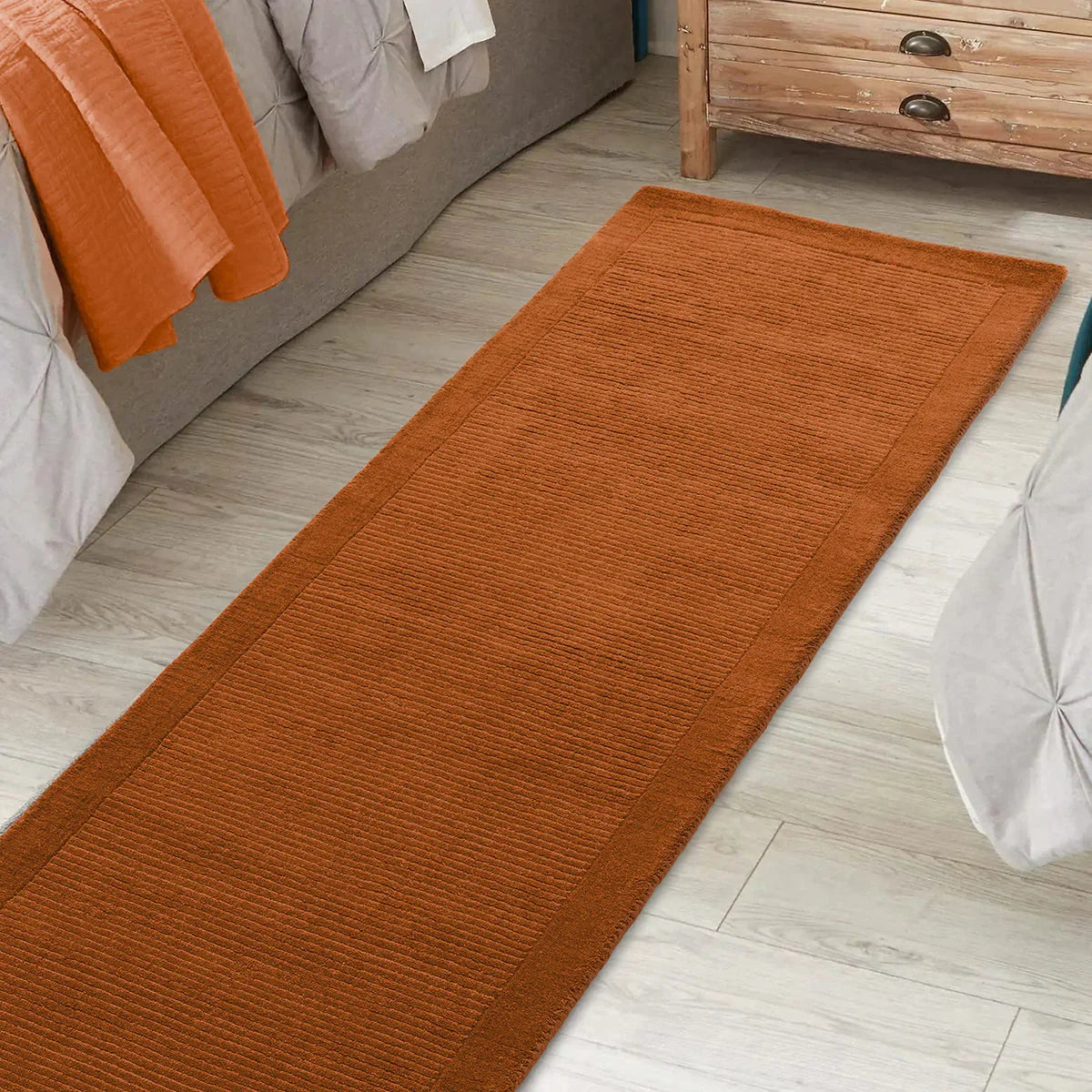 Asiatic York Terracotta Runner featuring ribbed pattern in terracotta on pale grey floor, machine-made polypropylene