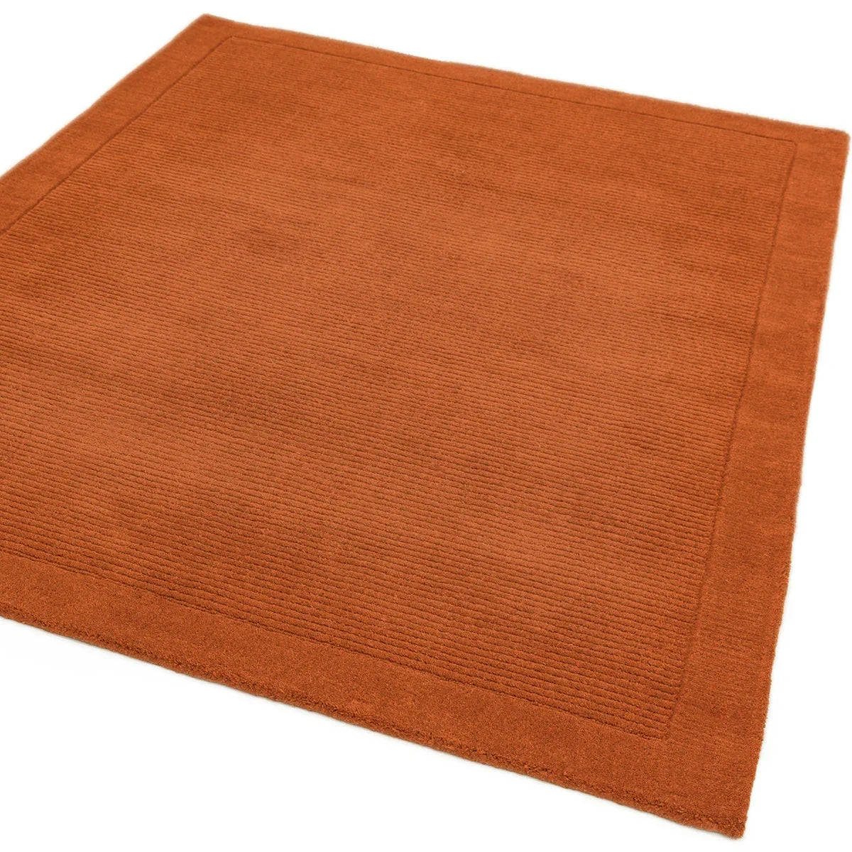 Asiatic York Terracotta Designer Rug featuring textured solid pattern in terracotta on terracotta background, construction method unknown, material unknown