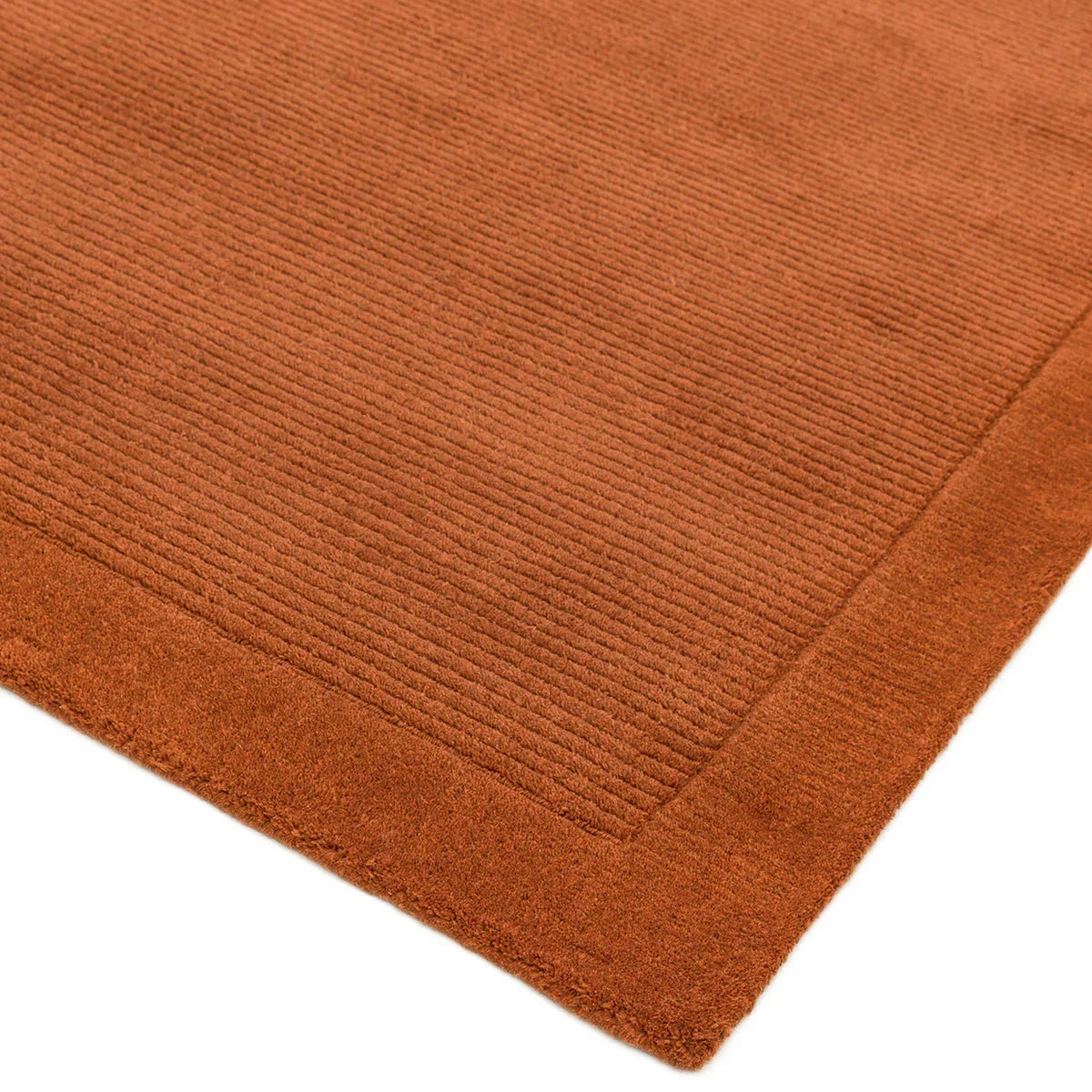 Asiatic York Terracotta Rug featuring ribbed corduroy pattern in terracotta on warm terracotta background, machine-made wool