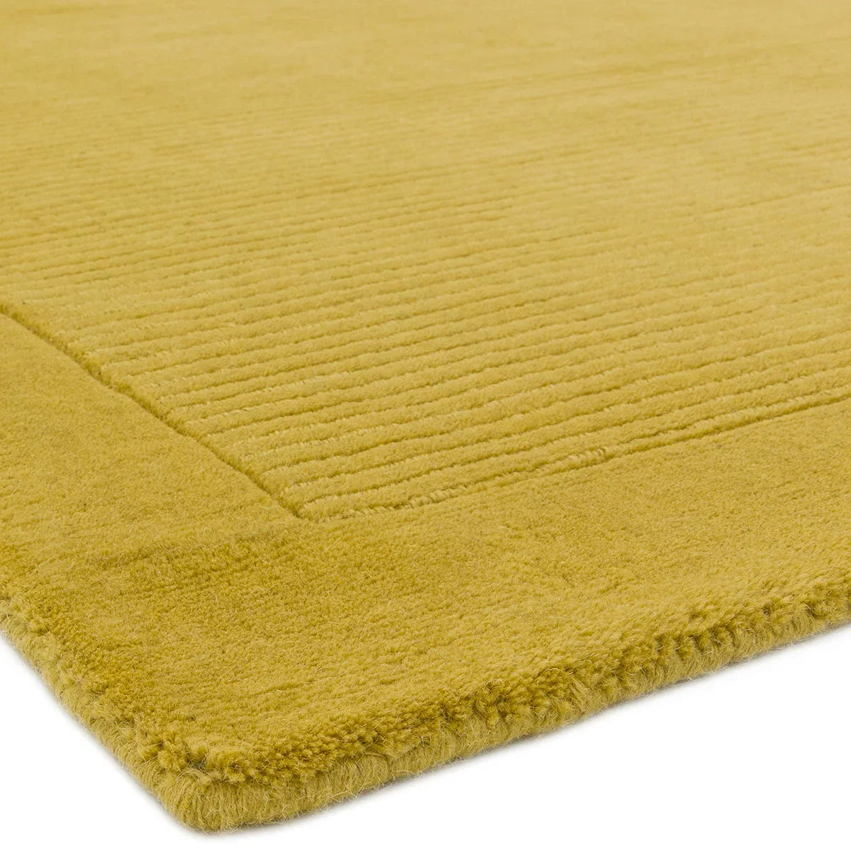 Asiatic York Yellow Designer Rug featuring solid ribbed texture in mustard yellow on pale yellow background, hand-tufted wool