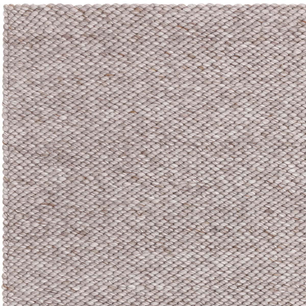 Asiatic Zander Charcoal Designer Rug featuring a textured weave in charcoal, grey and taupe on neutral backdrop, hand-tufted wool