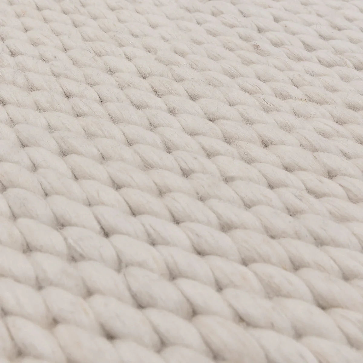 Asiatic Zander Ivory Designer Rug featuring chunky braided weave in ivory and cream on cream background, hand-loomed wool