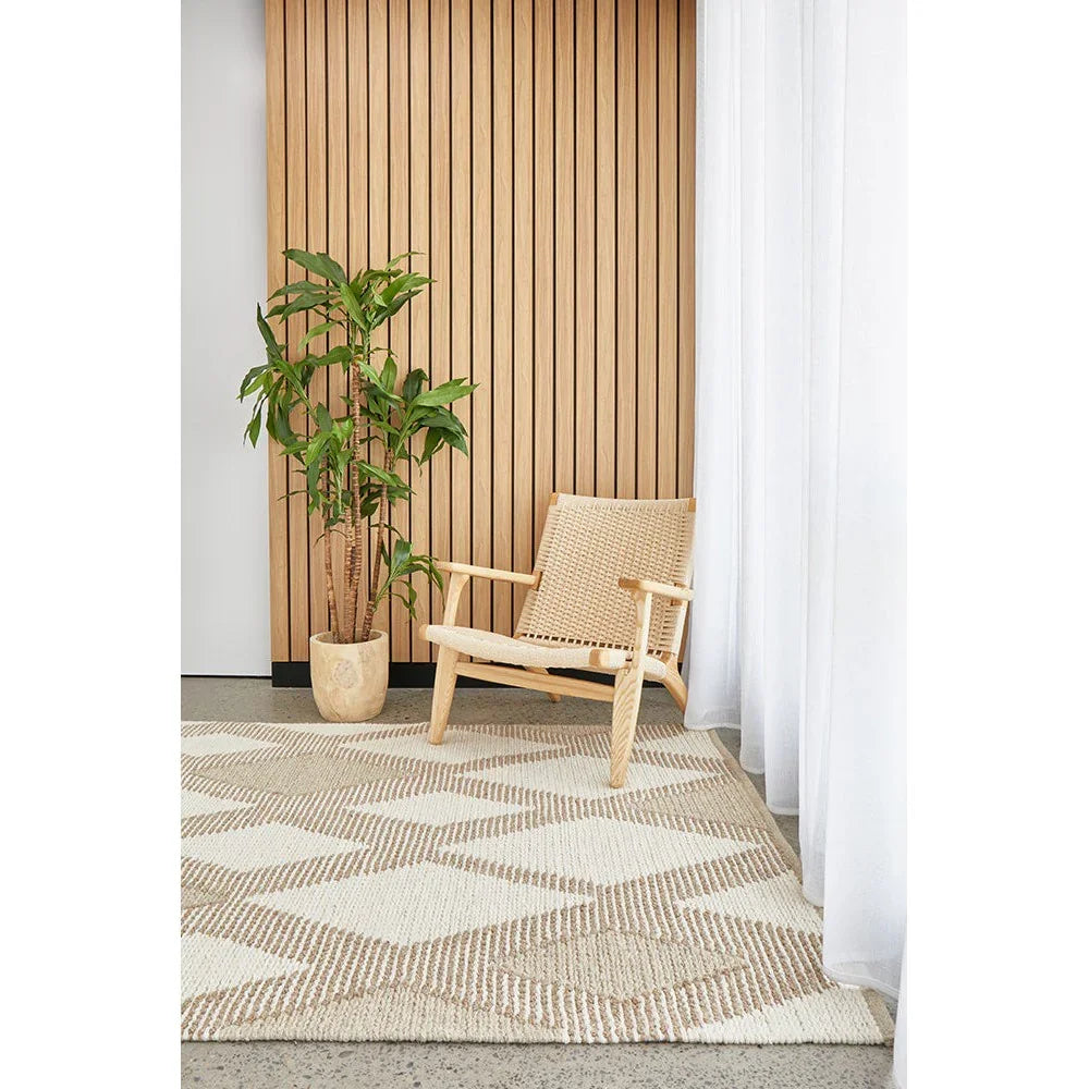 Avalon Shelly Natural Rug featuring geometric diamond pattern in cream, beige and taupe on light grey floor, handwoven jute