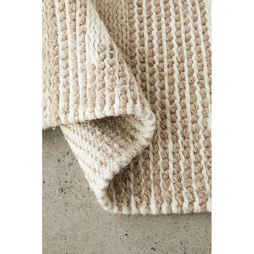 Avalon Taylor Natural Rug featuring chunky boucle stripes in cream, beige and tan on natural background, hand-tufted wool