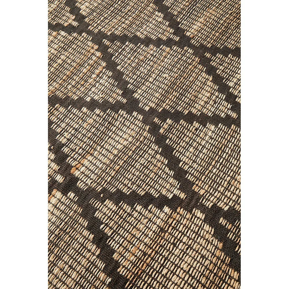 Bali Mocha Rug featuring geometric blocks in dark brown, mocha and beige on charcoal background, sustainably hand-woven wool