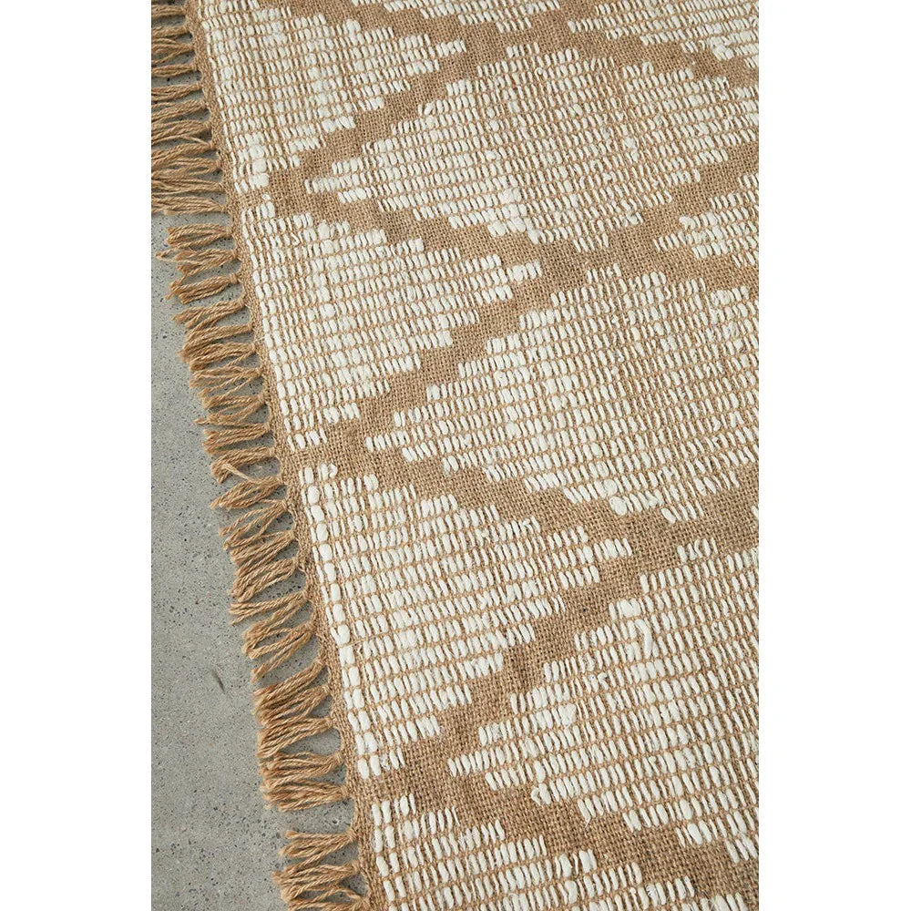 Bali Natural Rug featuring geometric diamond pattern in camel and ivory on warm tan background, handwoven jute