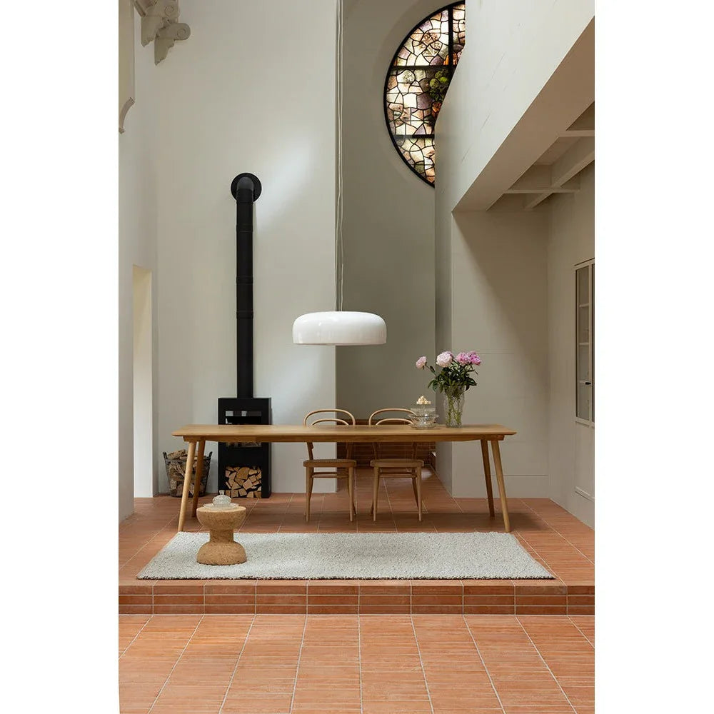 Brink & Campman Bond Ash Designer Rug featuring minimalist solid texture in light grey, ash and beige on terracotta floor, hand-tufted wool