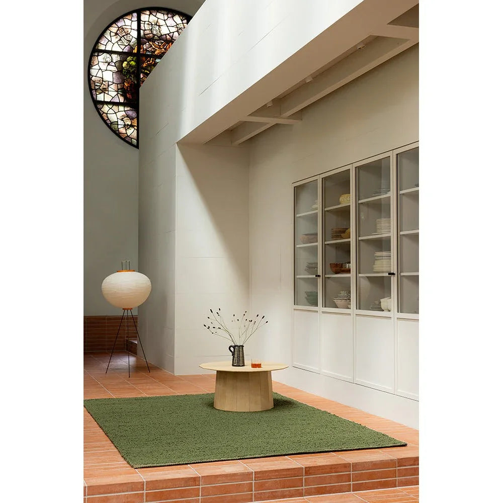 Brink & Campman Bond Moss Designer Rug featuring solid moss green texture on terracotta tile floor and cream walls, hand-tufted wool