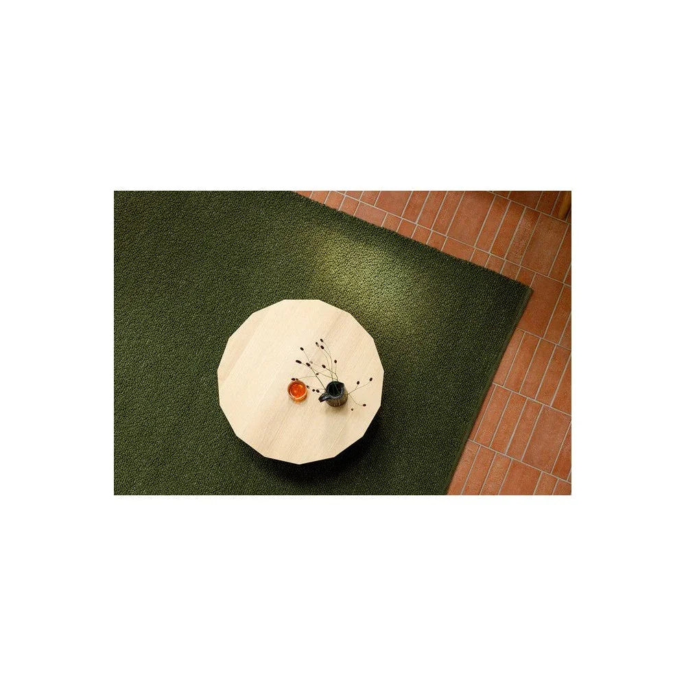 Brink & Campman Bond Moss Rug featuring moss-green texture in moss green, olive & cream on terracotta tile background, hand-tufted wool
