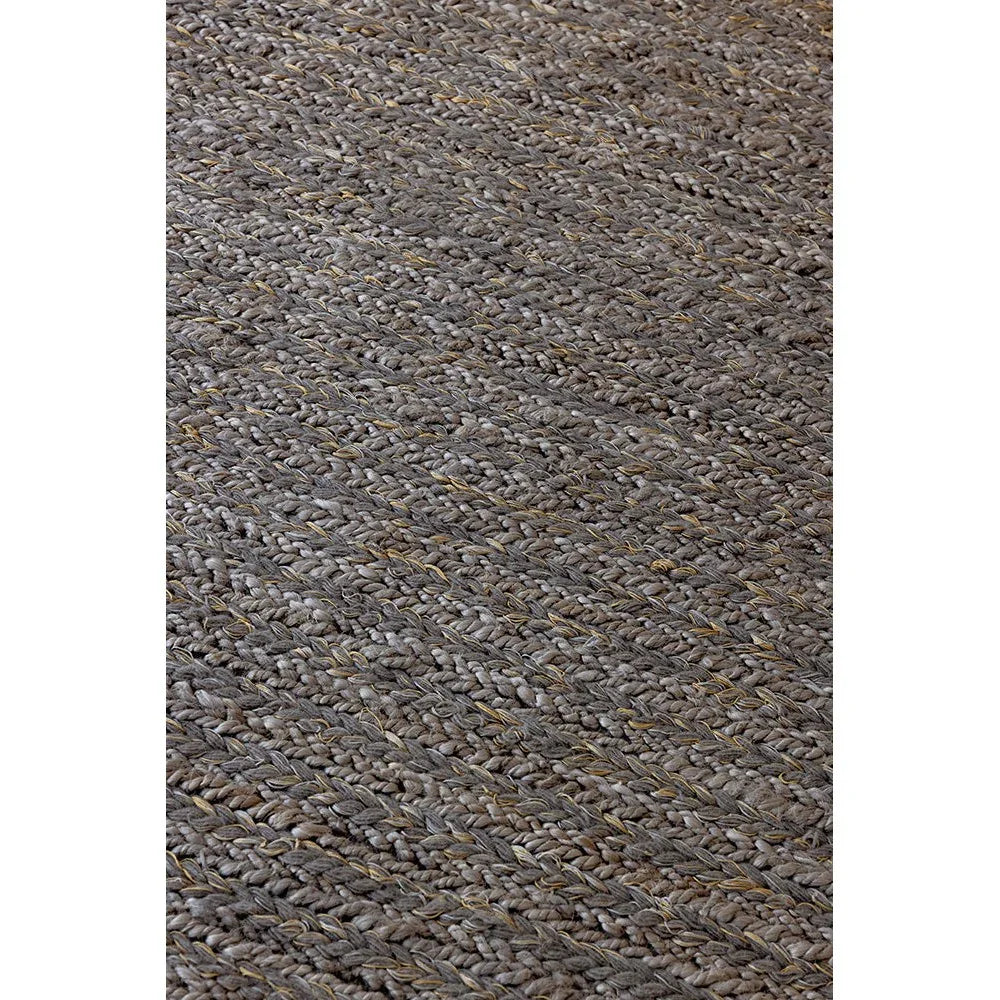 Brink & Campman Craft Plait Stone Rug featuring braided plait in stone grey, charcoal and taupe on neutral background, hand-braided jute blend