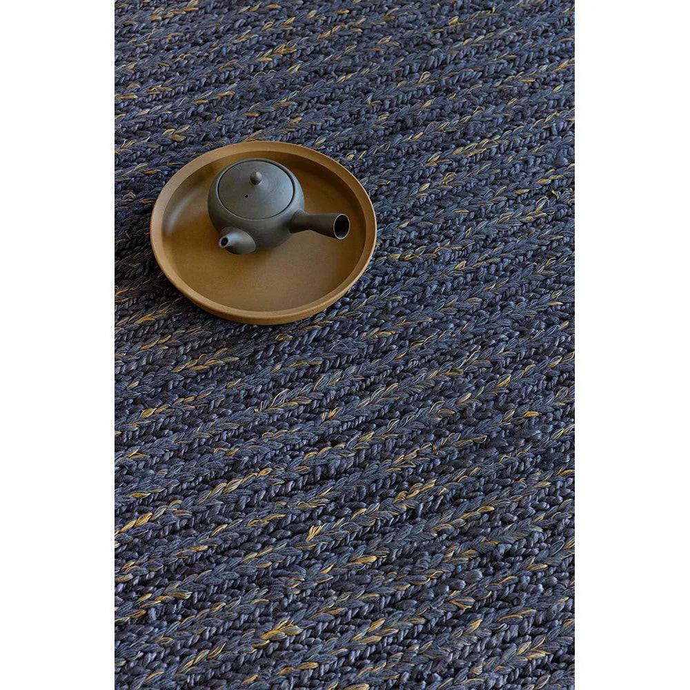 Brink & Campman Craft Plait Denim rug featuring braided plait weave in navy blue, indigo and beige on denim background, hand-woven wool